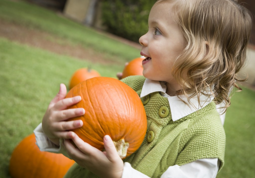 child and pumpkin